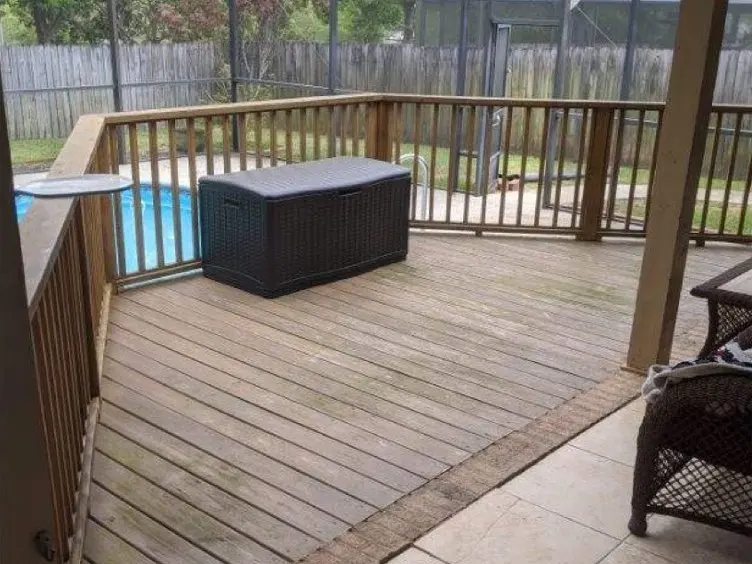 Wood deck and tile patio under a covered porch