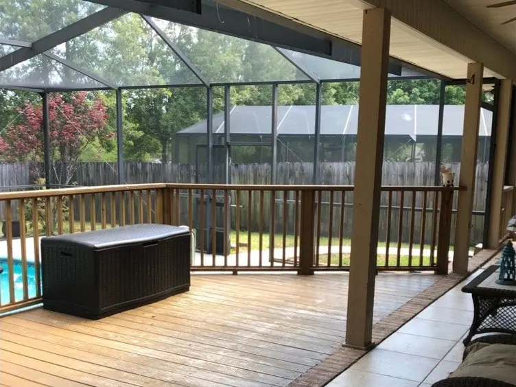Wood deck and tile under a covered porch, second angle